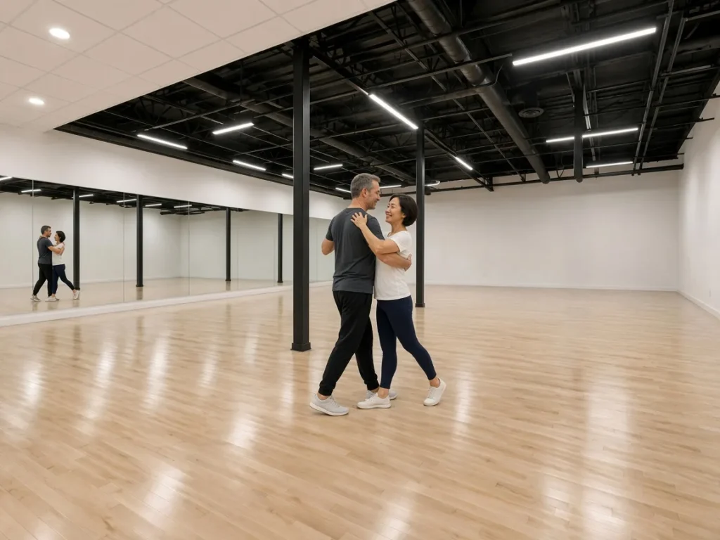Couple dancing Argentine Tango in a close embrace in an Alhambra dance studio