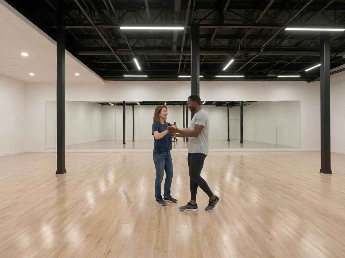 Beginner learning country two step basics with an instructor in an Alhambra studio