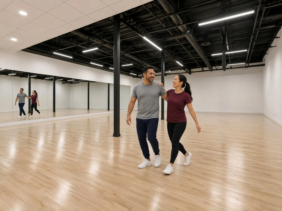 Instructor demonstrating country two step technique to a student in an Alhambra studio