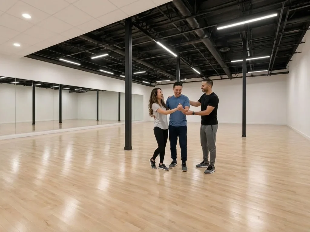 Couple taking a dance lesson together with an instructor