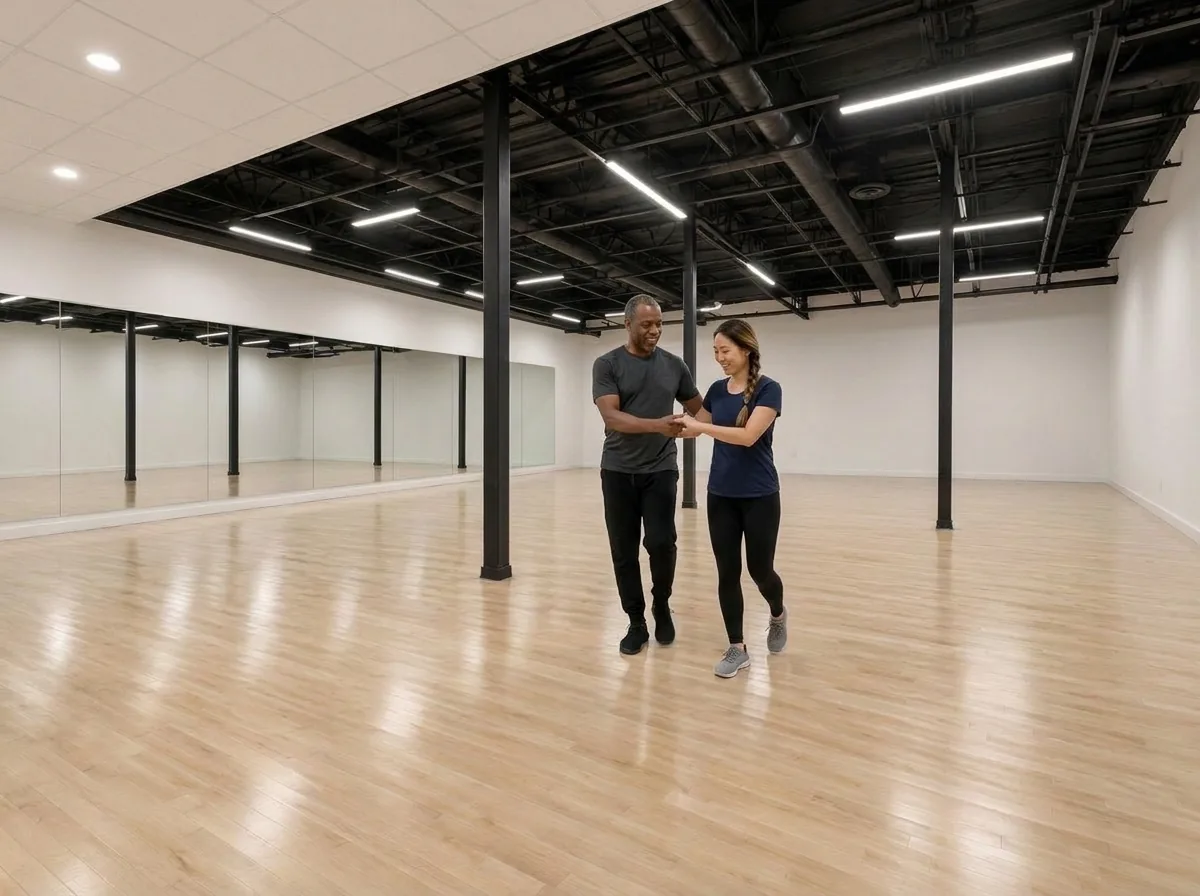 Beginner learning foxtrot basics with an instructor