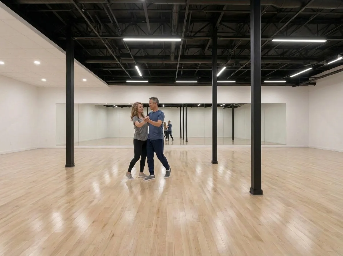 Couple dancing foxtrot together on the studio floor