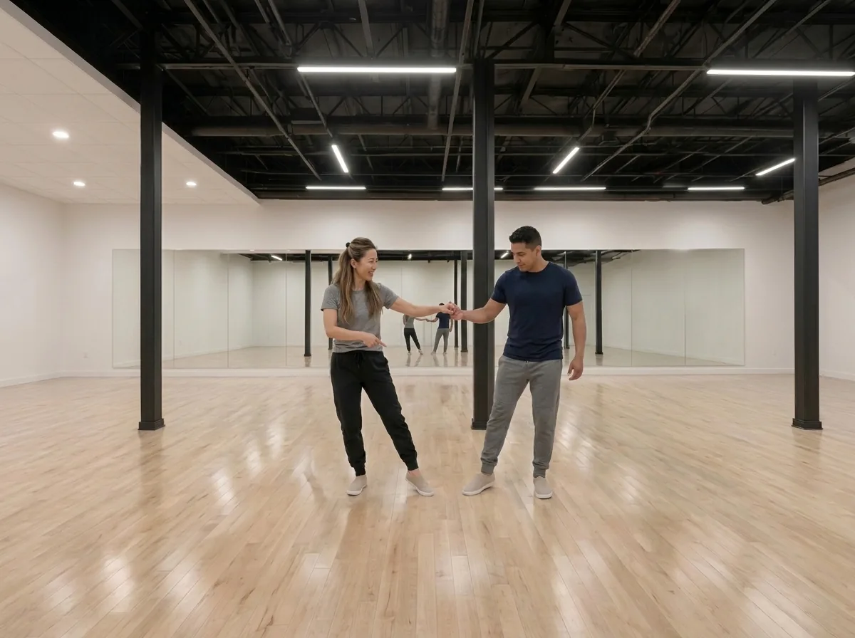 Instructor demonstrating hustle turn technique to a student in Alhambra