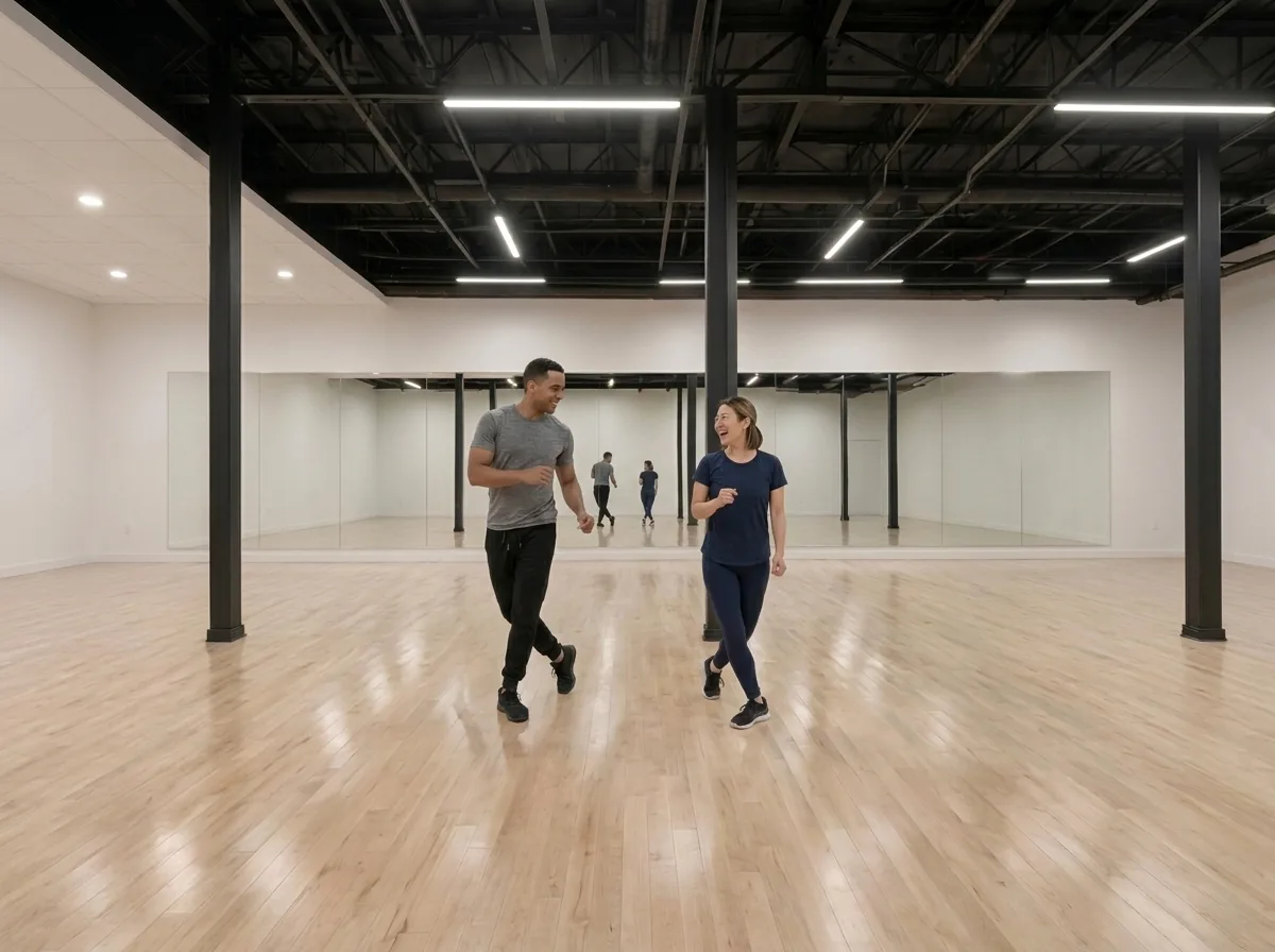 Instructor demonstrating mambo technique to a student in Alhambra