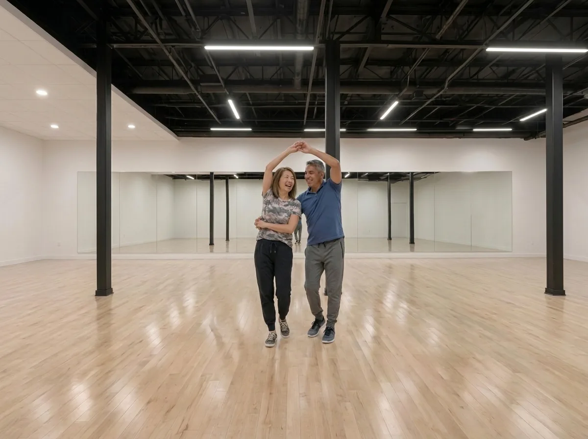 Couple dancing merengue on the studio floor in Alhambra