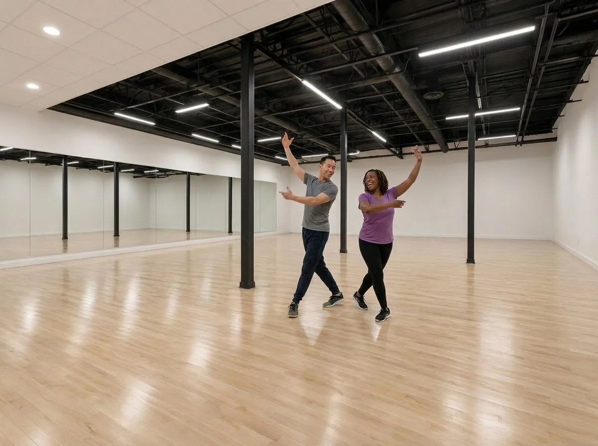 Instructor demonstrating paso doble shaping and arm lines to a student