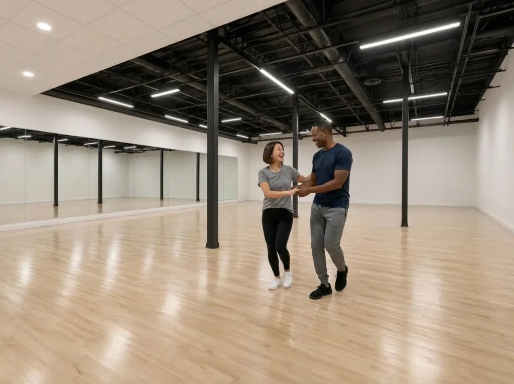 Couple dancing a rhythm style together in the studio