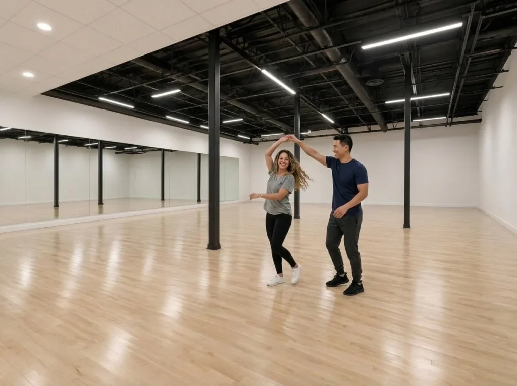 Couple dancing salsa together in the studio
