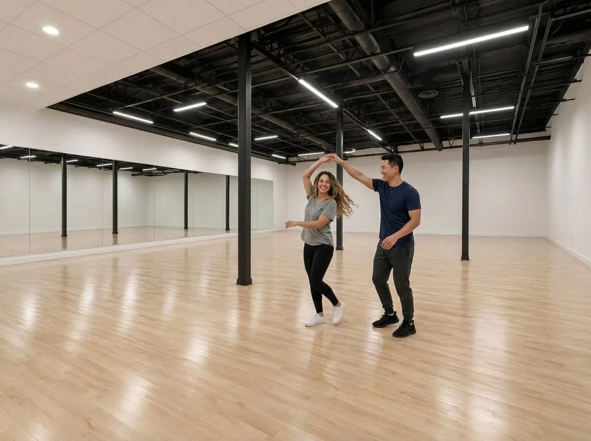 Couple dancing salsa together in the studio