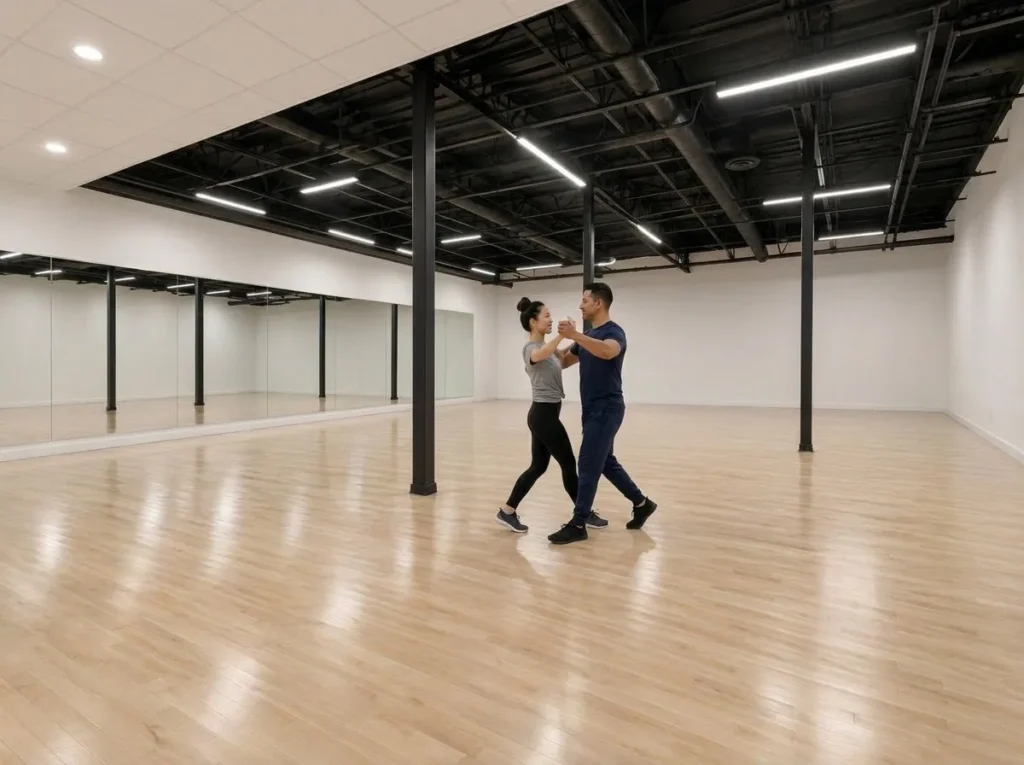 Couple in standard ballroom hold moving across the studio floor