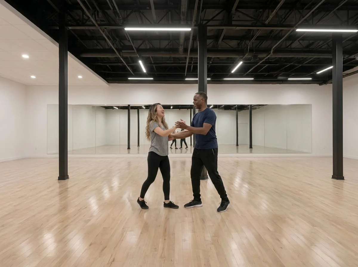 Beginner learning the waltz box step with an instructor
