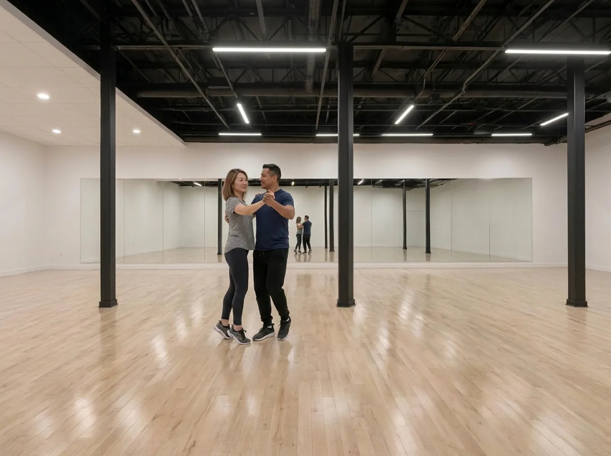 Couple dancing a waltz together in the studio