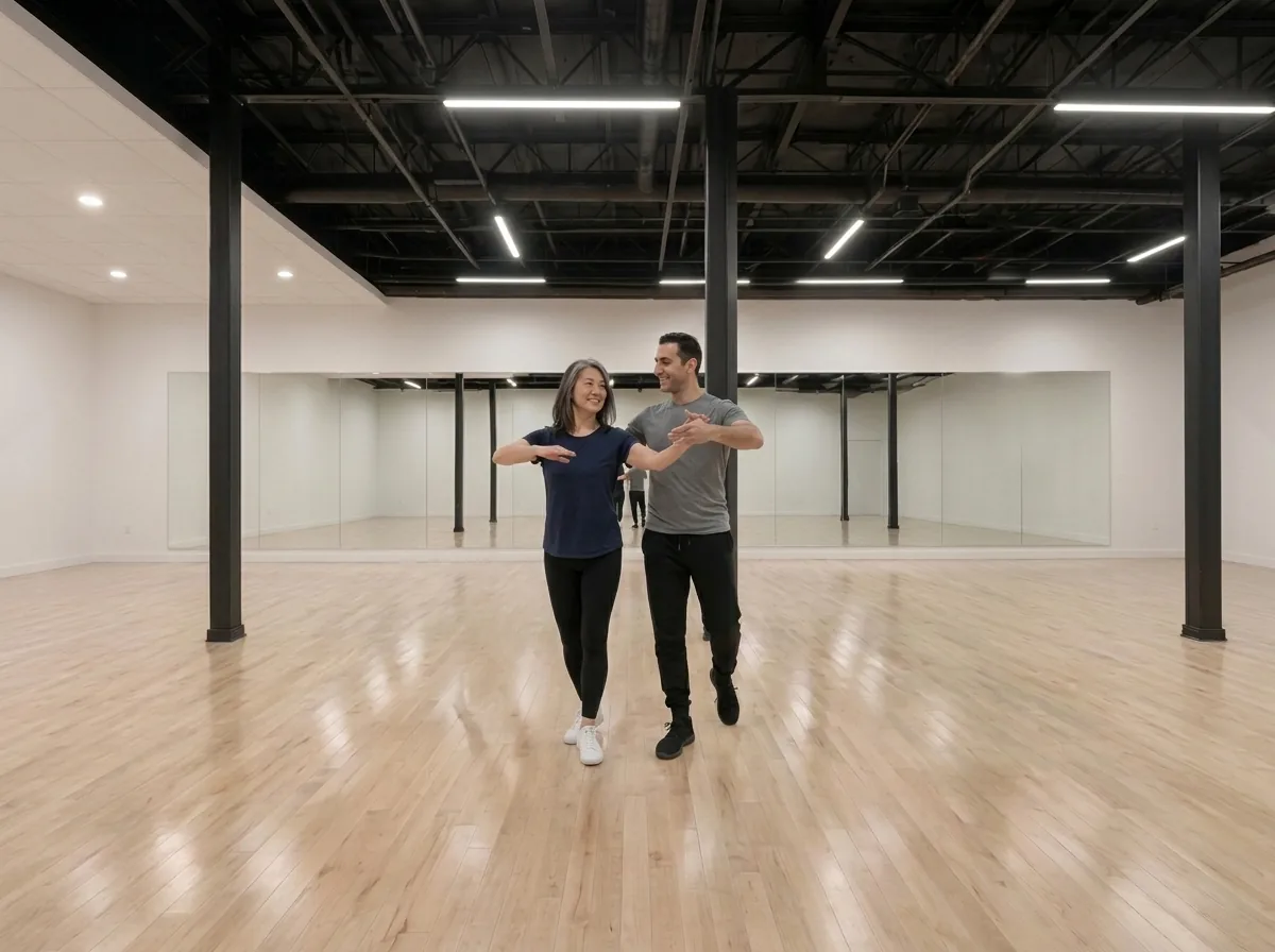 Instructor demonstrating waltz frame and posture to a student