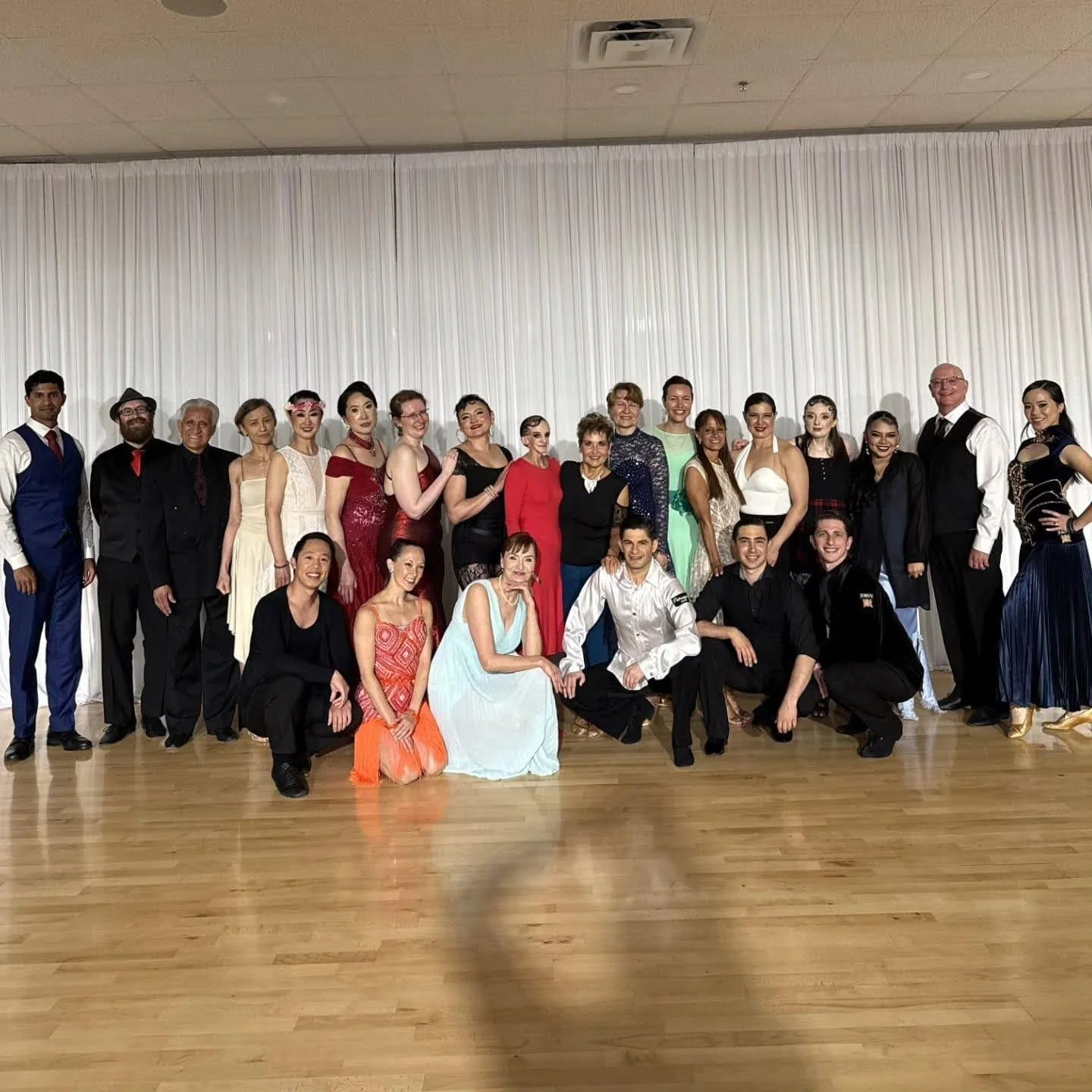 Instructors and students in dance outfits at a Fred Astaire Dance Studios event in Ann Arbor, MI