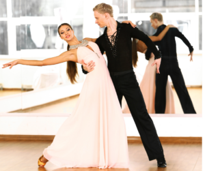 young couple dancing wearing a pink dress