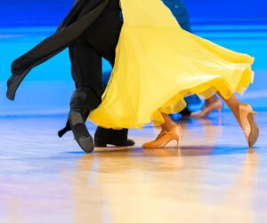 couple dancing wearing a yellow dress