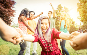 Group of students making party in the park