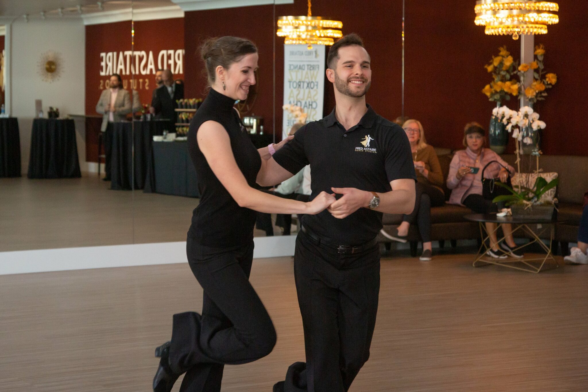 Certified ballroom dance instructor Gentry Fielder and his dance partner Lisa demonstrate a dance move at Fred Astaire Boise dance studio.