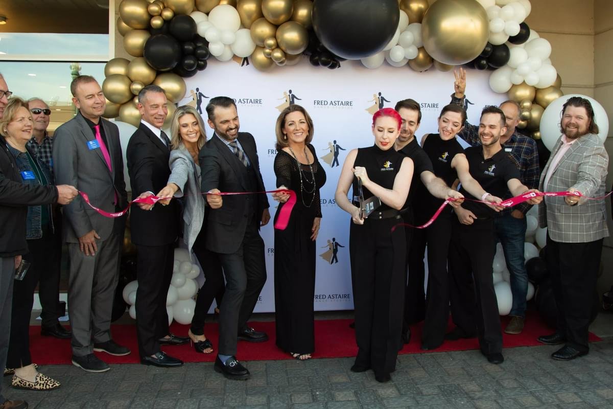 Fred Astaire Boise studio manager Lisa cuts the ribbon as studio instructors, community members, and the studio franchisee celebrate the studio opening in downtown Boise.