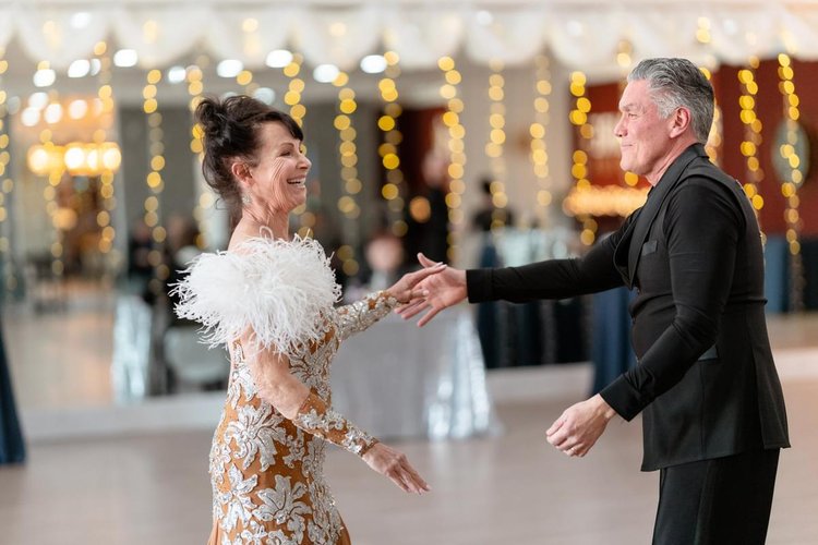 Art and Carol Laos smile at each other on the dance floor at Fred Astaire Boise.