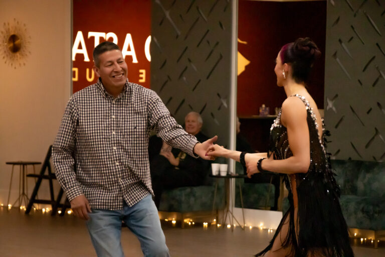 A smiling pair of dancers doing the Country Western Two-Step in Boise.