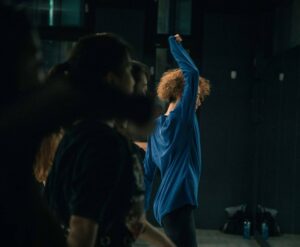 Group of people in a dance class practicing movements.