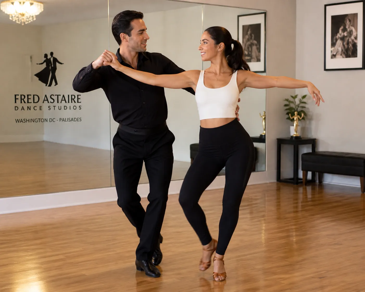 Couple practicing merengue during a Latin dance lesson at Fred Astaire Dance Studios Washington DC Palisades.