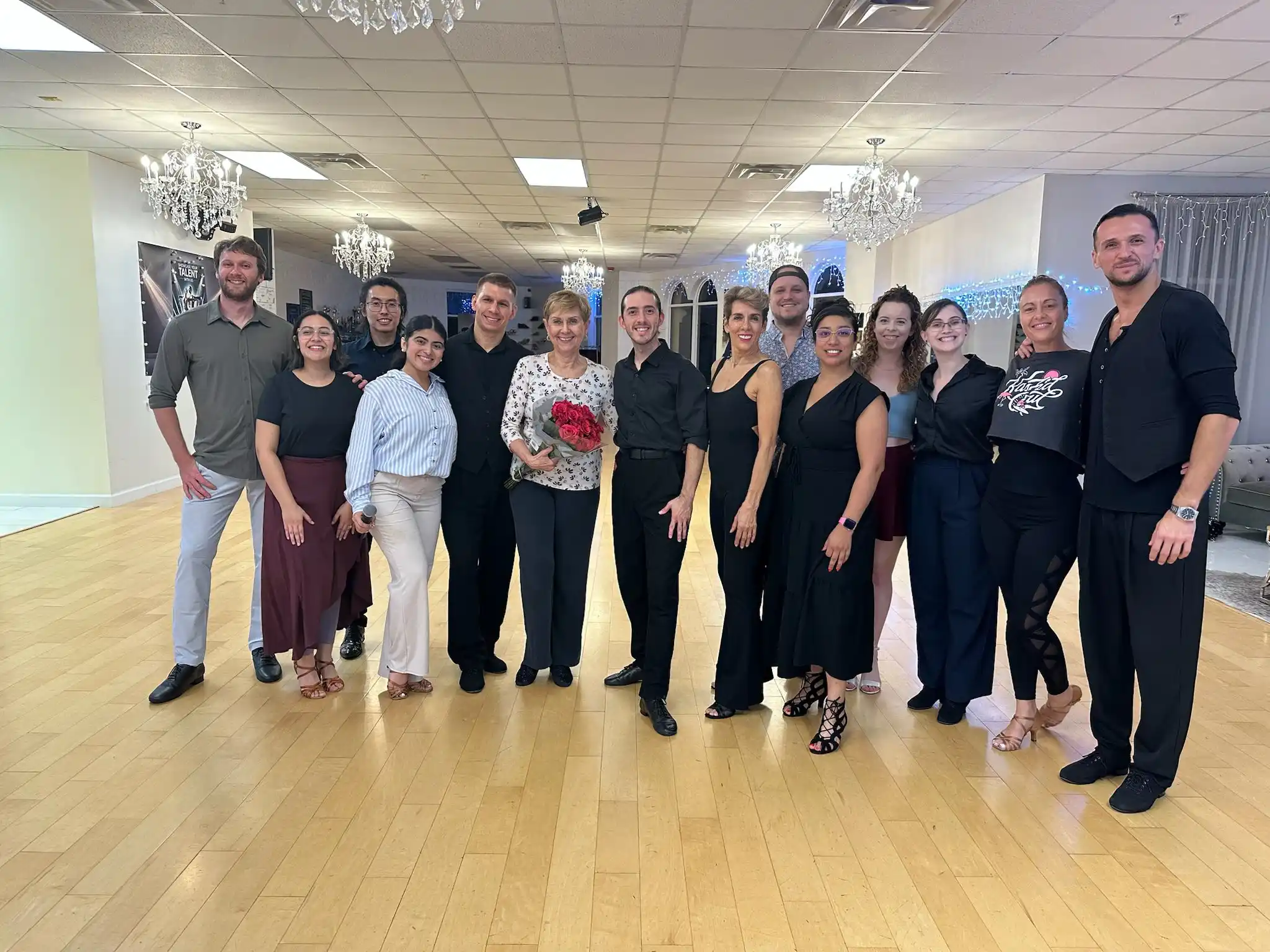 Group of adults in a dance studio exploring different dance styles to learn as an adult.