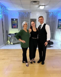 Look More Confident When Dancing: A ballroom dance couple performs an expressive dance routine with confident posture and elegant movements, showcasing their stage presence and dancing skills.