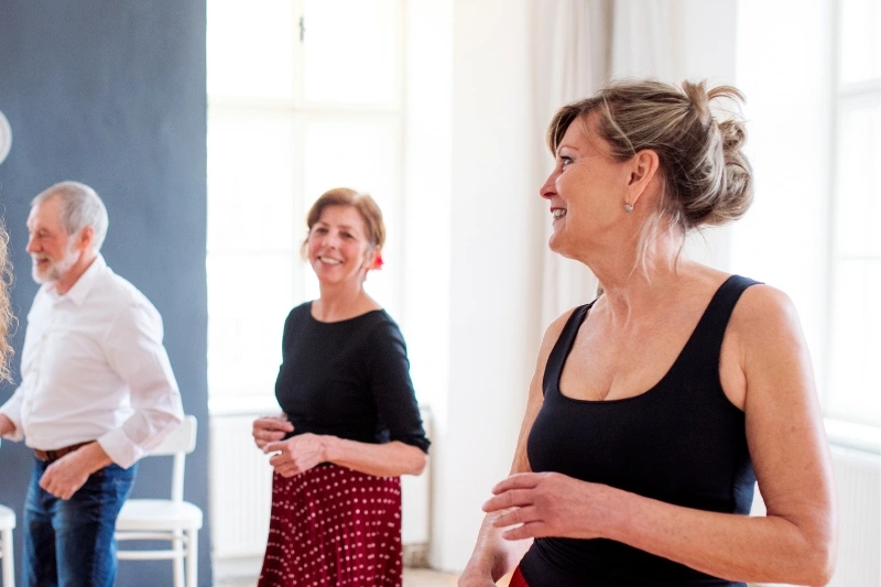 two ladies take dance dance lessons at a dance studio in Durham.