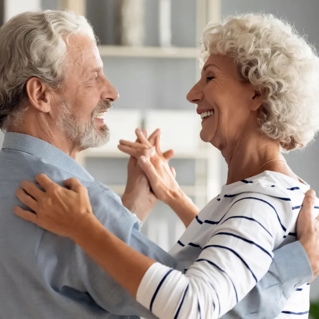 Senior couple dancing together.