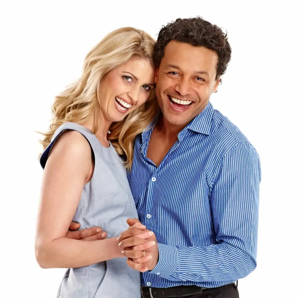 Man and woman smile while dancing and taking lessons at a dance studio Durham.