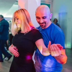Young couple take cha cha dance lessons in Durham.