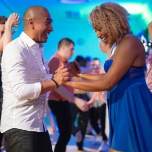 Man and woman taking hustle dance lessons in Durham.