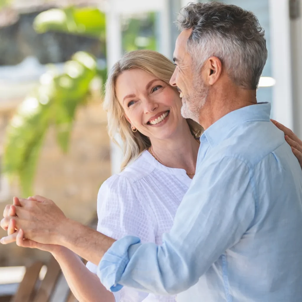 A middle aged man and woman take Quickstep dance lessons in Durham.