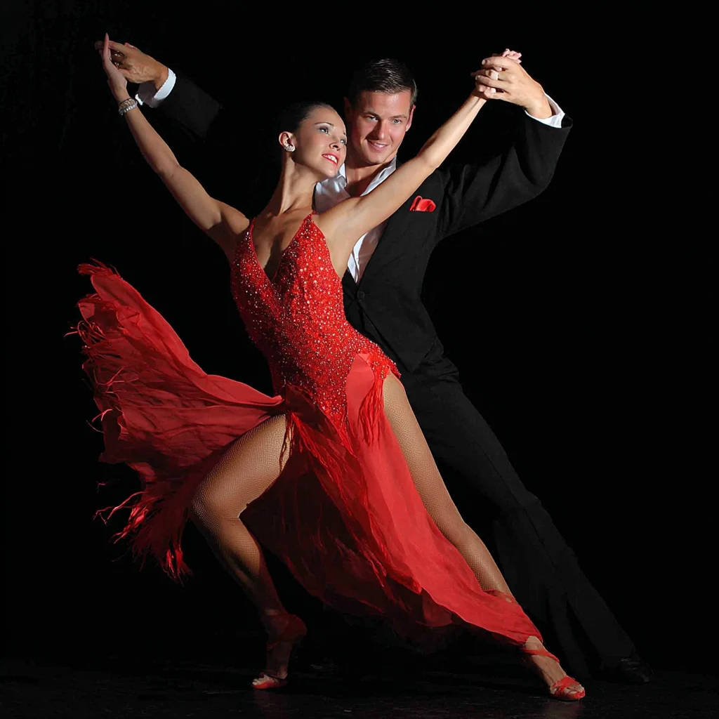 A couple takes jive dance lessons in fiery dance attire.