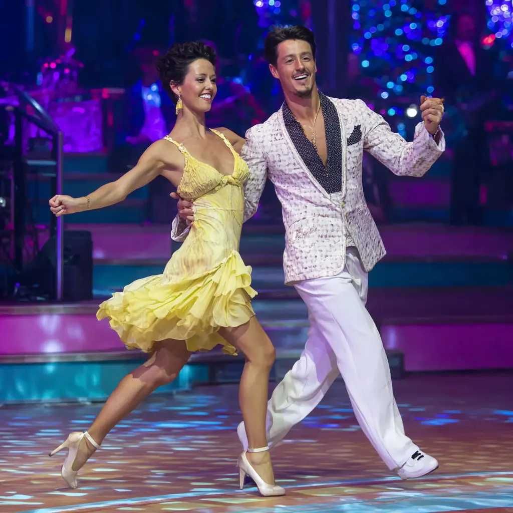 Man and woman take jive dance lessons on a dance floor in Durham.