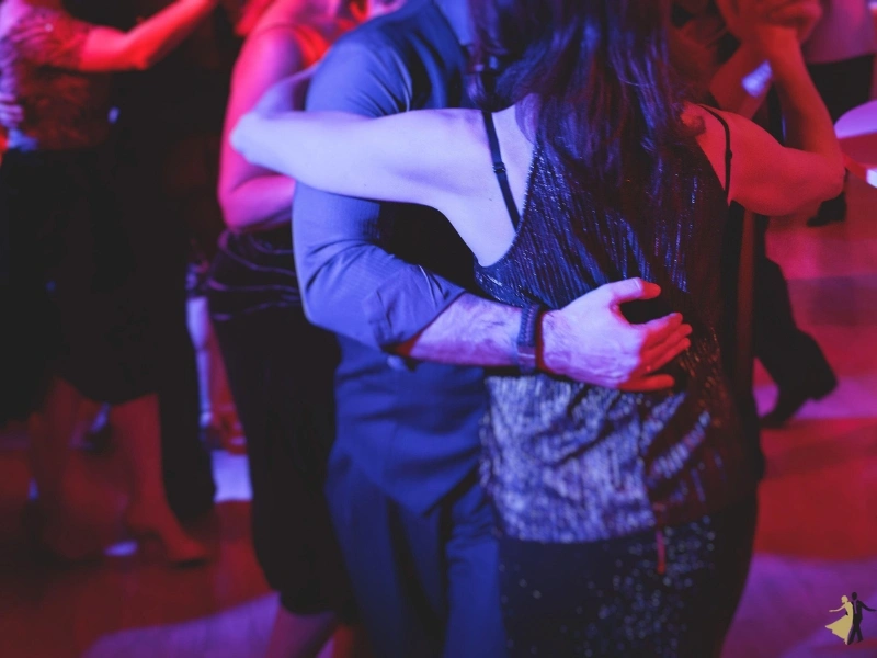 Couples taking Merengue lessons in a Durham dance studio. Merengue is a favored dance style.