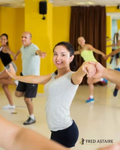 Couple taking swing dance lessons at Fred Astaire Dance Studio in Durham, NC