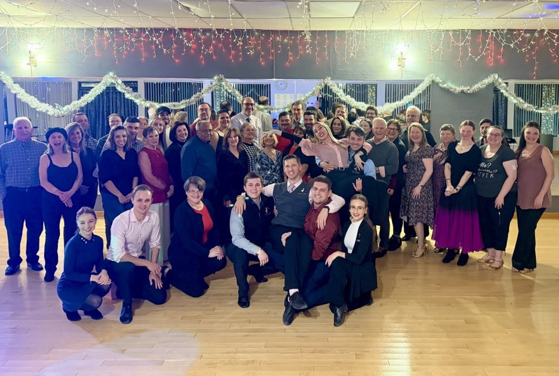 Dance community gathered together at a studio social event.