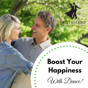 Man and woman smiling at each other while dancing together