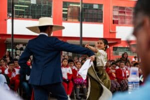 Male and female street performers dancing the Rumba on a city street.