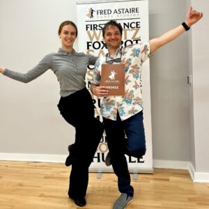 Student and instructor posing together after completing Latin dance classes in Morrisville at Fred Astaire Dance Studios, celebrating progress in partner dancing and social dance training.