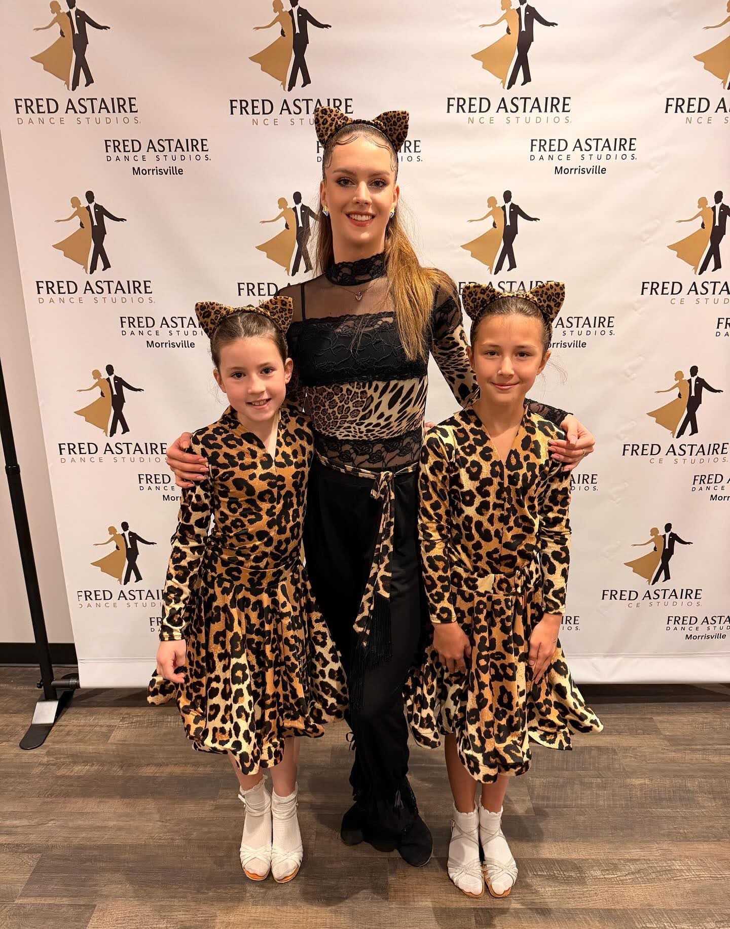 Students posing in costume at a Fred Astaire Dance Studios event during children’s ballroom dancing classes, showcasing young dancers learning performance skills and confidence through ballroom dance.