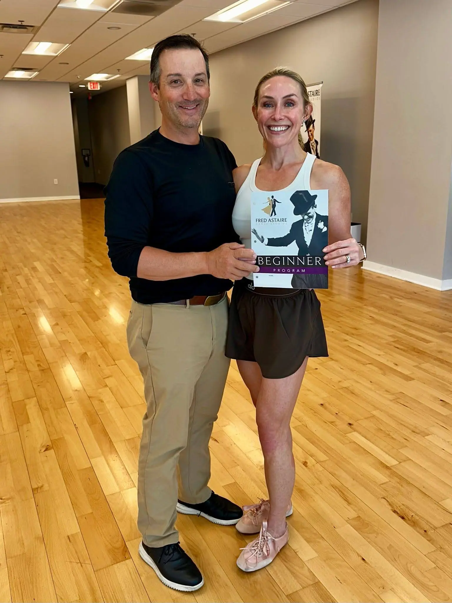 New dance students celebrating their progress during beginner dance lessons in Morrisville, NC.