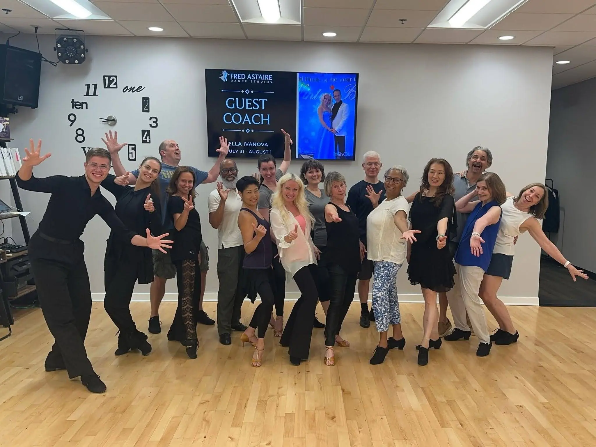 Group of adults posing in a dance studio after a class, showcasing the Best Latin Dance Styles to Learn in Morrisville.