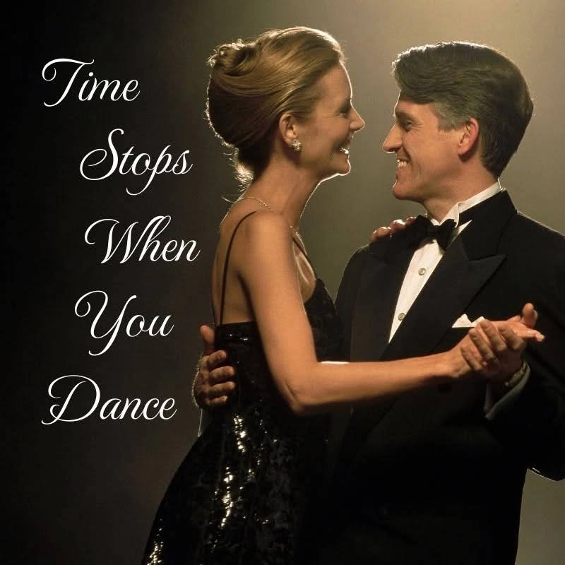 Smiling couple shares a romantic ballroom dance during an elegant evening.