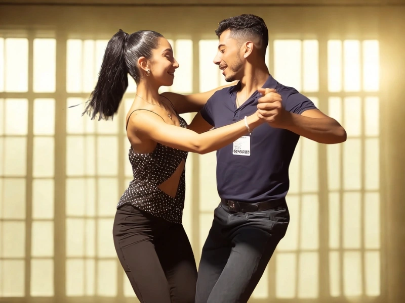 A couples takes cha cha dance lessons in Raleigh.