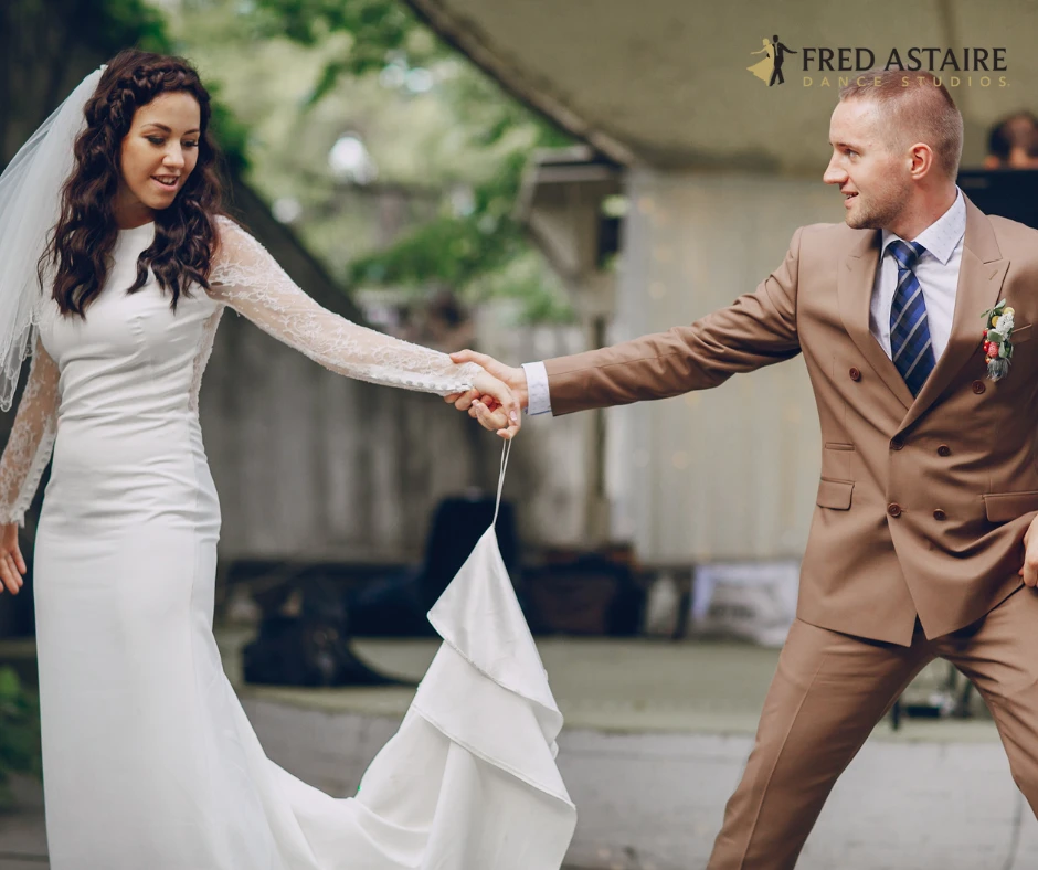 a couple dancing to a latin dance wedding song