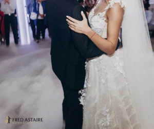 a man and woman dancing to wedding first dance songs